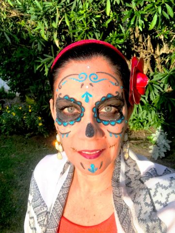 I used stick-on Catrina make-up for a Dia de los Muertos look.