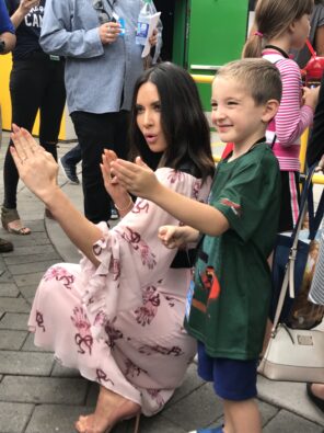 Olivia Munn provides the voice of Koko. Seen here teaching her balck belt moves to a fan.